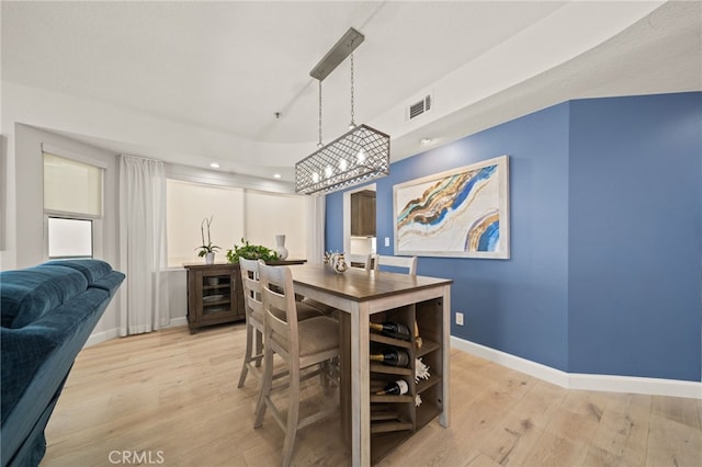 dining area with recessed lighting, light wood-type flooring, visible vents, and baseboards