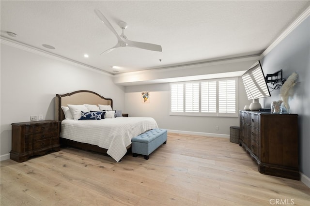 bedroom with baseboards, light wood-type flooring, and crown molding