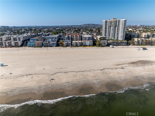 drone / aerial view with a city view and a water view