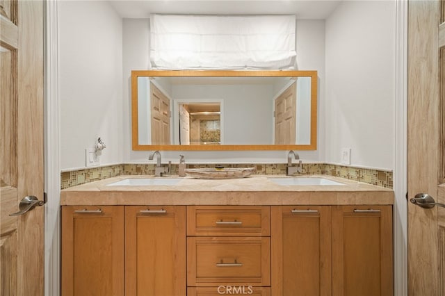 full bath featuring double vanity and a sink