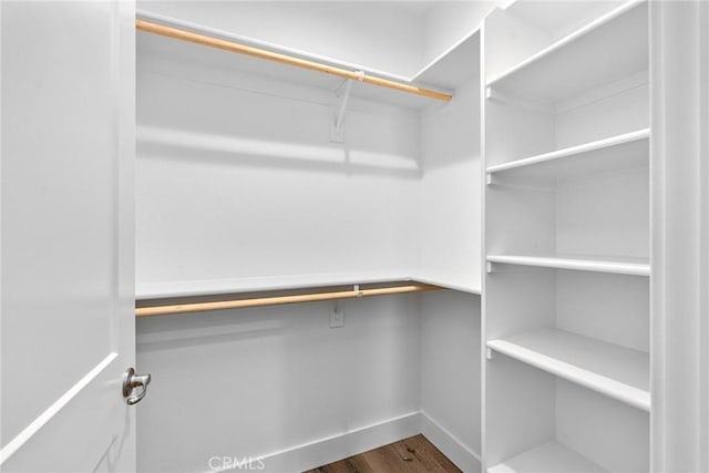 walk in closet featuring hardwood / wood-style floors