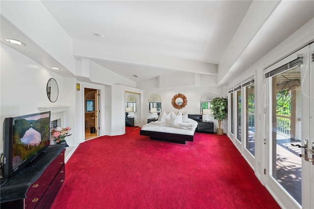 bedroom with lofted ceiling, access to exterior, french doors, and carpet flooring