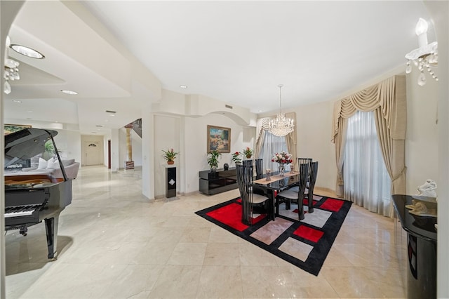 dining area featuring an inviting chandelier