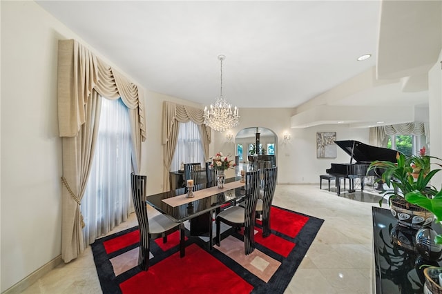 dining area featuring an inviting chandelier