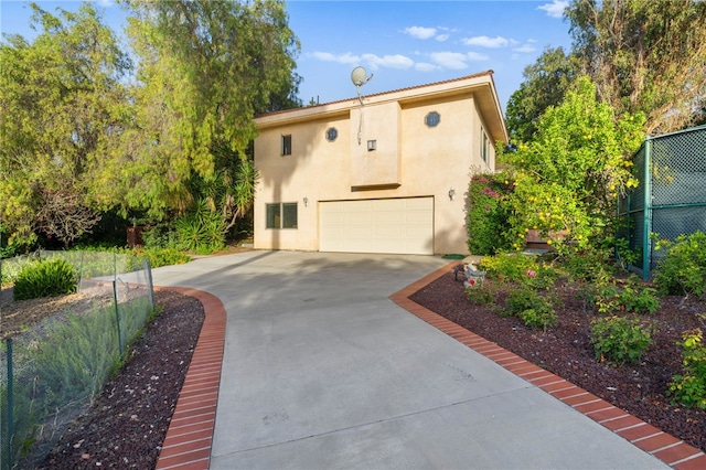 view of front of property with a garage