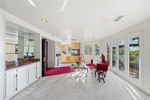 interior space with light colored carpet and french doors