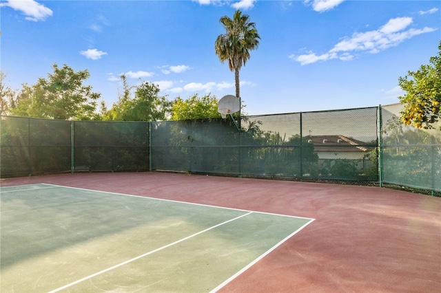 view of sport court with basketball hoop