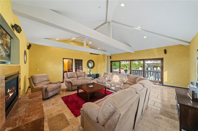 living room with high vaulted ceiling and beamed ceiling