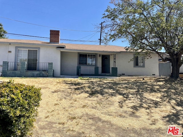 ranch-style house with covered porch