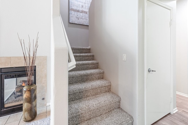 staircase featuring light hardwood / wood-style flooring