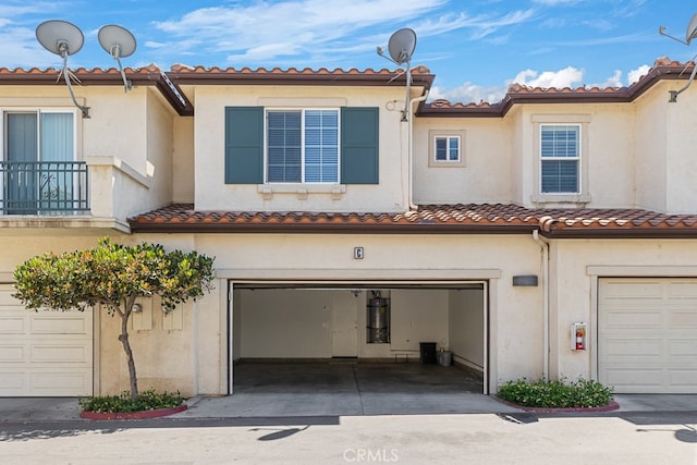 exterior space with a balcony and a garage