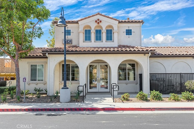 mediterranean / spanish-style home featuring covered porch