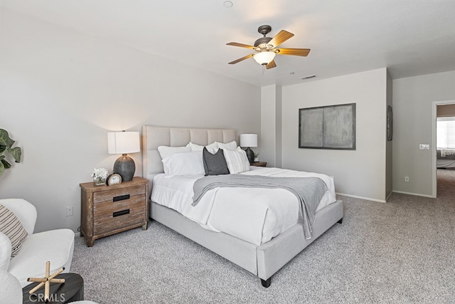 carpeted bedroom featuring ceiling fan