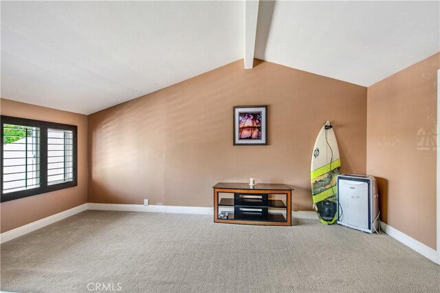 playroom with carpet and lofted ceiling with beams