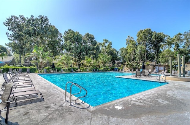 view of swimming pool with a patio