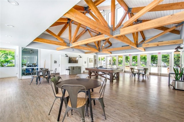 dining room with french doors, high vaulted ceiling, beamed ceiling, billiards, and hardwood / wood-style floors