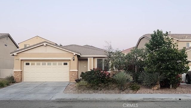 view of front of home with a garage