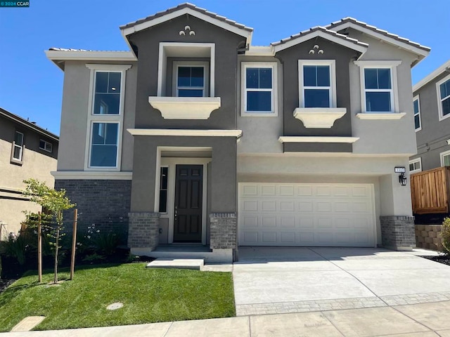 view of front of house featuring a garage and a front yard