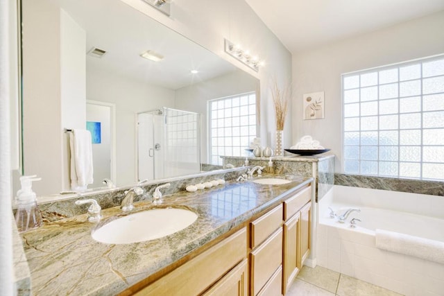 bathroom featuring tile patterned floors, vanity, and independent shower and bath