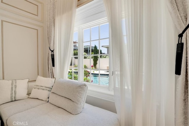 carpeted bedroom with multiple windows