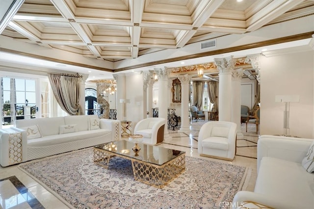 living room featuring ornate columns, a chandelier, coffered ceiling, and crown molding