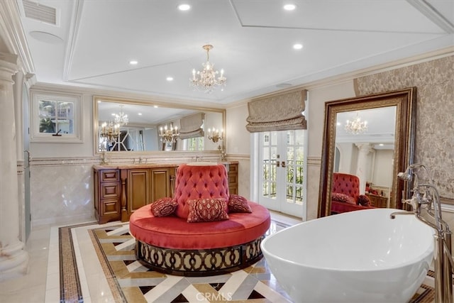 dining area featuring a chandelier, french doors, and crown molding