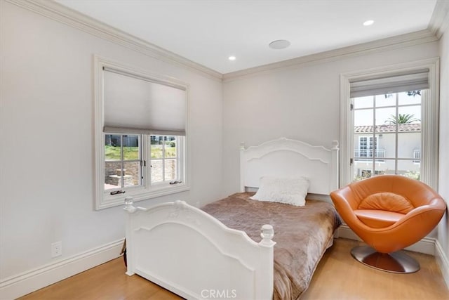 bedroom with baseboards, recessed lighting, wood finished floors, and ornamental molding