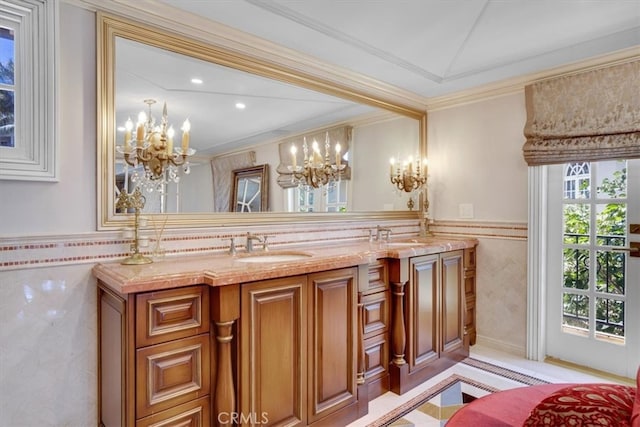 bathroom featuring crown molding, vanity, tile walls, and a chandelier