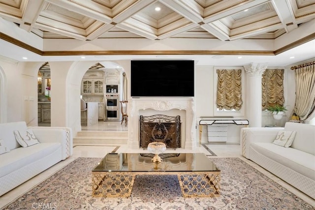 living area featuring coffered ceiling, crown molding, arched walkways, and recessed lighting