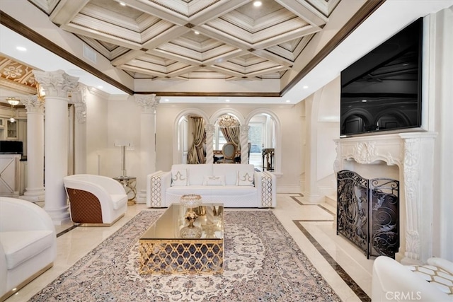 living room featuring decorative columns, coffered ceiling, a fireplace, and ornamental molding