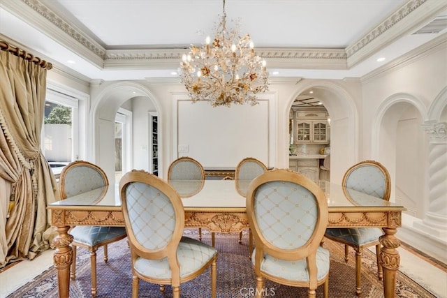 dining room featuring a notable chandelier and crown molding