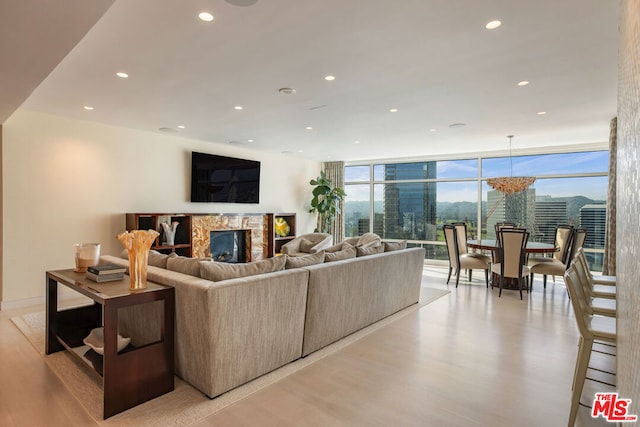 living room with light hardwood / wood-style flooring and expansive windows