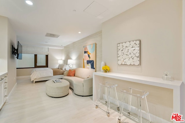 bedroom with light hardwood / wood-style flooring