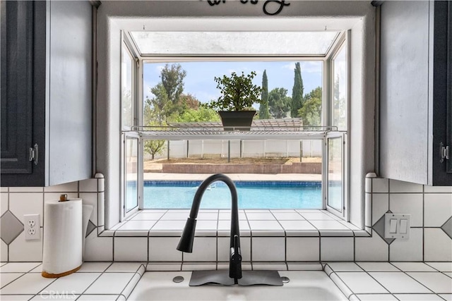 view of pool with sink