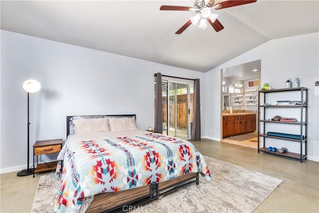 bedroom featuring ceiling fan, ensuite bathroom, and lofted ceiling