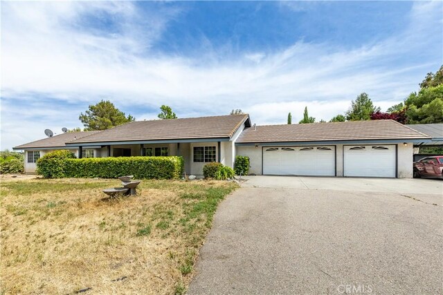 single story home with a garage