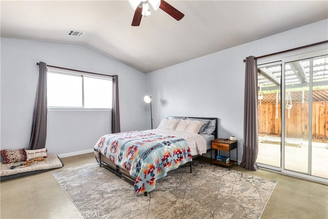 carpeted bedroom with access to outside, ceiling fan, multiple windows, and lofted ceiling