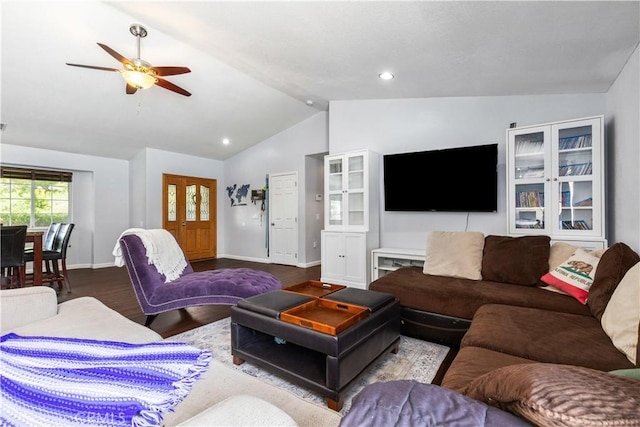 living room featuring ceiling fan, lofted ceiling, and light hardwood / wood-style floors