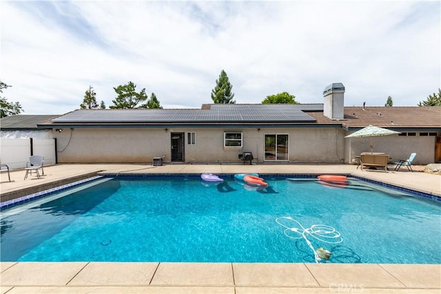 view of swimming pool with central AC and a patio