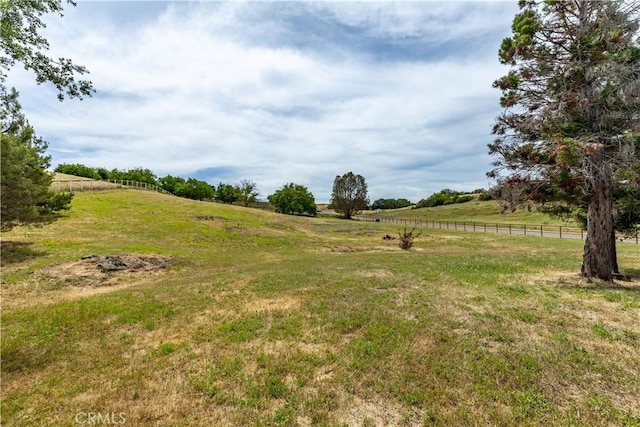 view of yard with a rural view