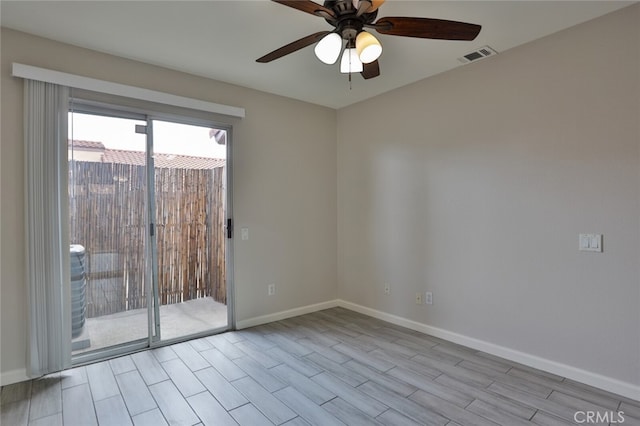 unfurnished room featuring light wood-type flooring and ceiling fan