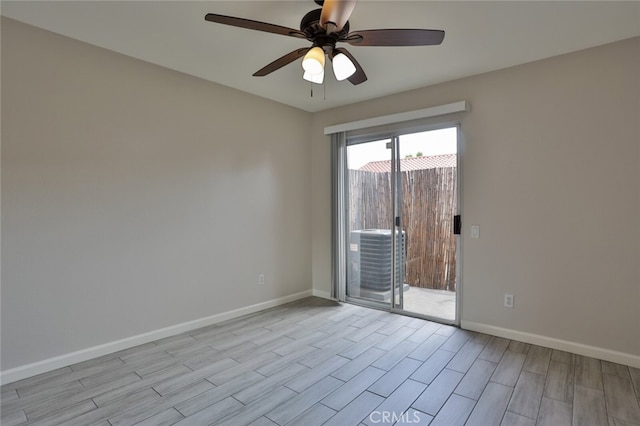 spare room featuring light hardwood / wood-style flooring and ceiling fan