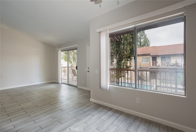 spare room featuring ceiling fan and light hardwood / wood-style flooring