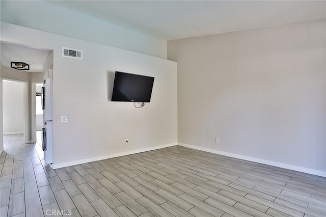 unfurnished room with light hardwood / wood-style floors