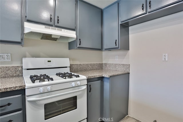 kitchen with white range with gas stovetop and gray cabinets