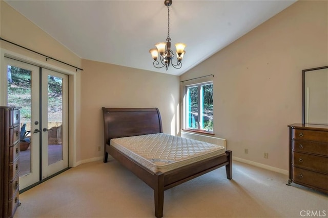 carpeted bedroom featuring multiple windows, french doors, and vaulted ceiling