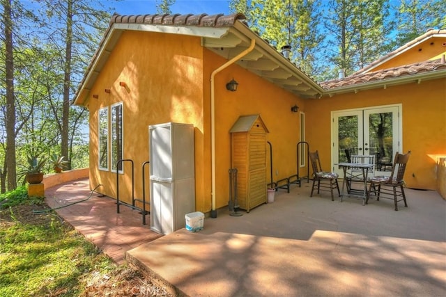 exterior space with french doors and a patio