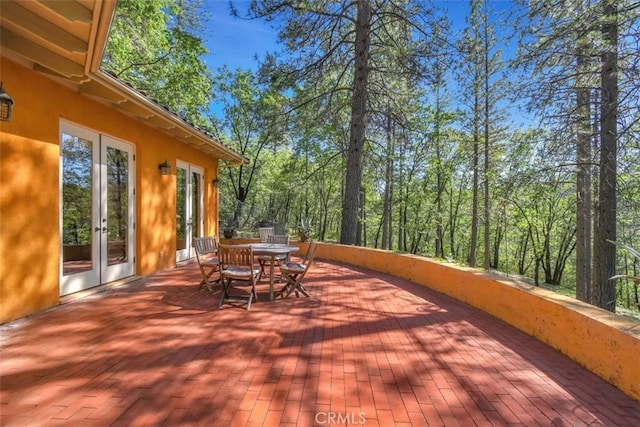 wooden deck featuring french doors