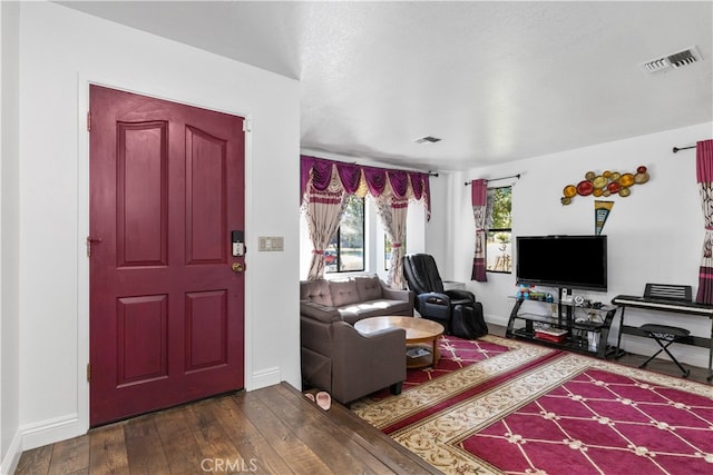 living room featuring dark hardwood / wood-style floors