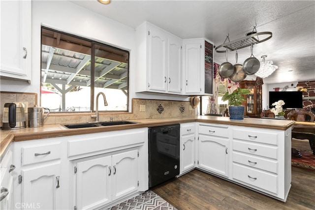 kitchen with dark hardwood / wood-style floors, tasteful backsplash, dishwasher, sink, and white cabinets